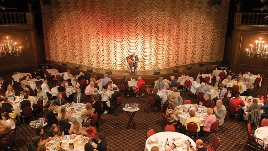 Dinner theater event with attendees