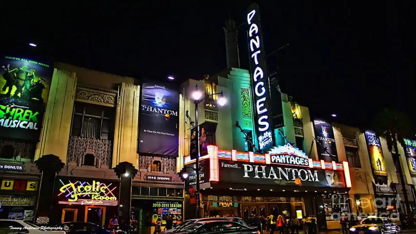 Theater entrance neon signs night