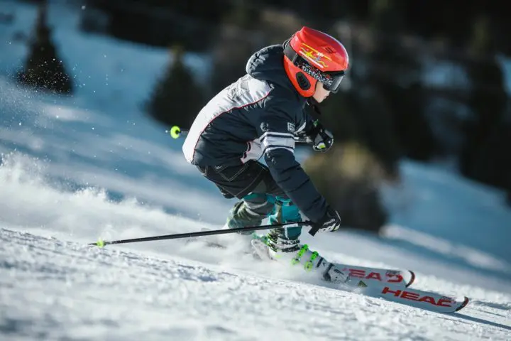 Child skiing on snowy mountain