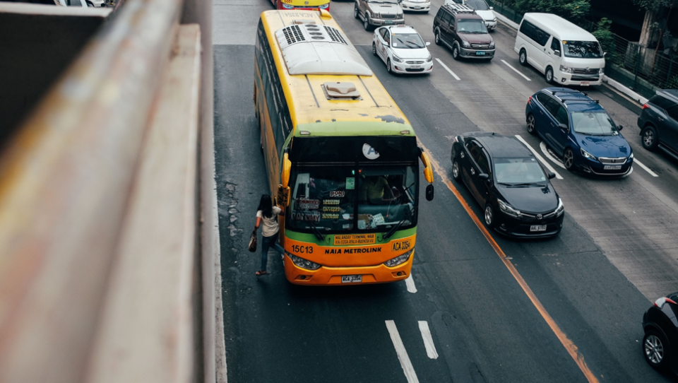 Yellow charter bus urban street