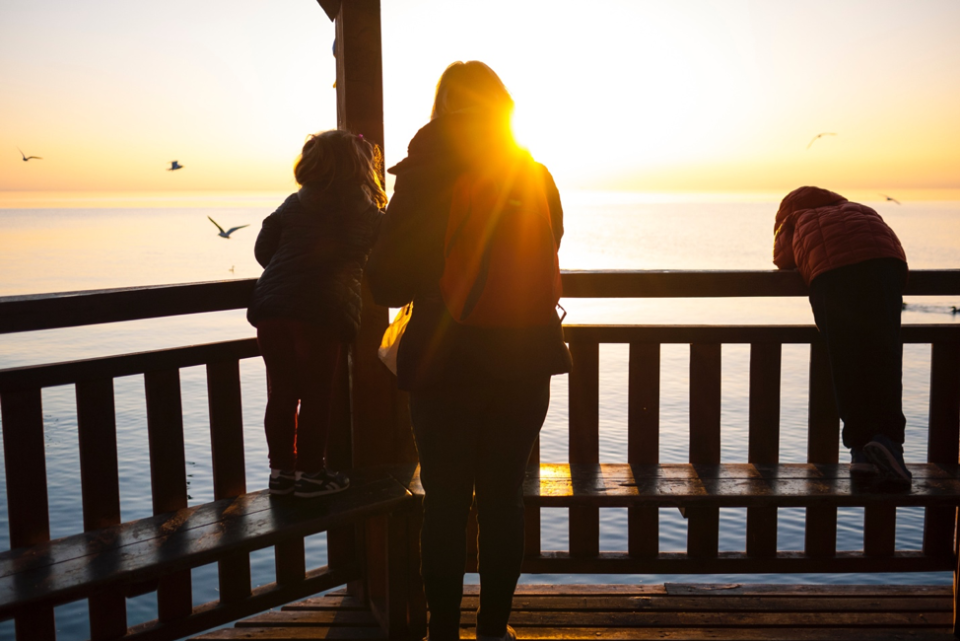 Sunset family viewing deck scene