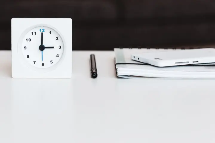 Desk clock pen and notebook