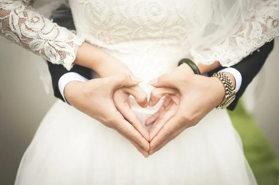 Wedding couple heart hands gesture