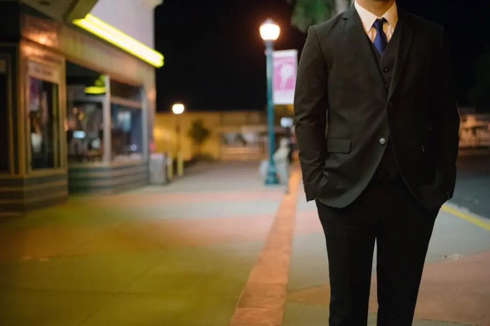 Businessman waiting downtown night