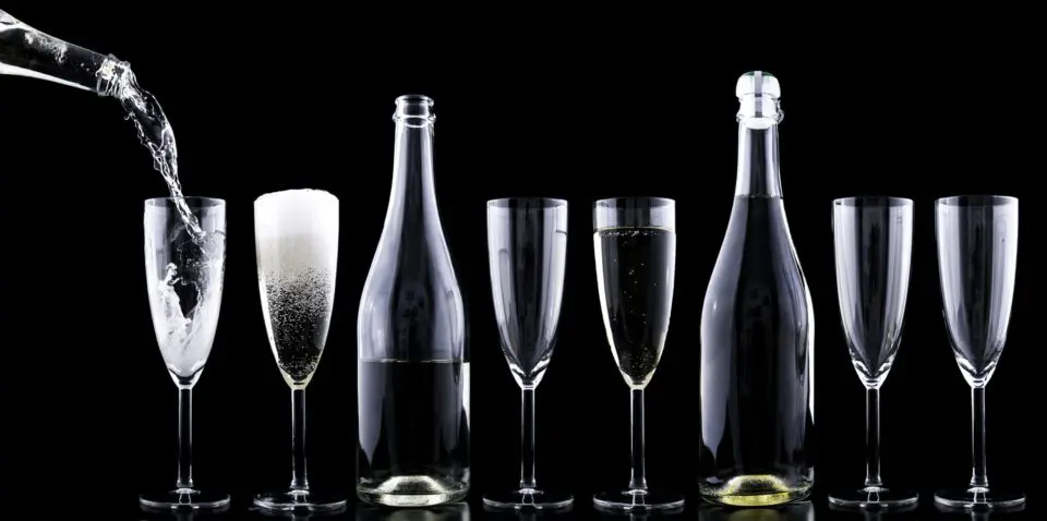 Champagne glasses and bottles alignment