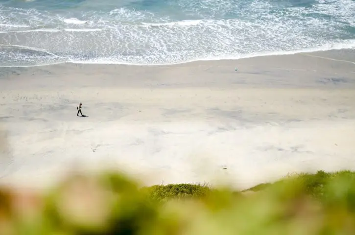 Person walking along beach