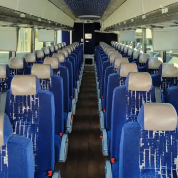 Spacious blue charter bus interior