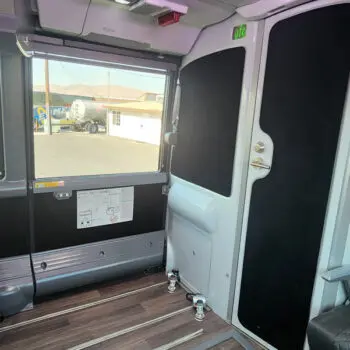 Spacious charter bus interior features