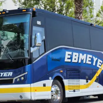 Charter bus driving on road