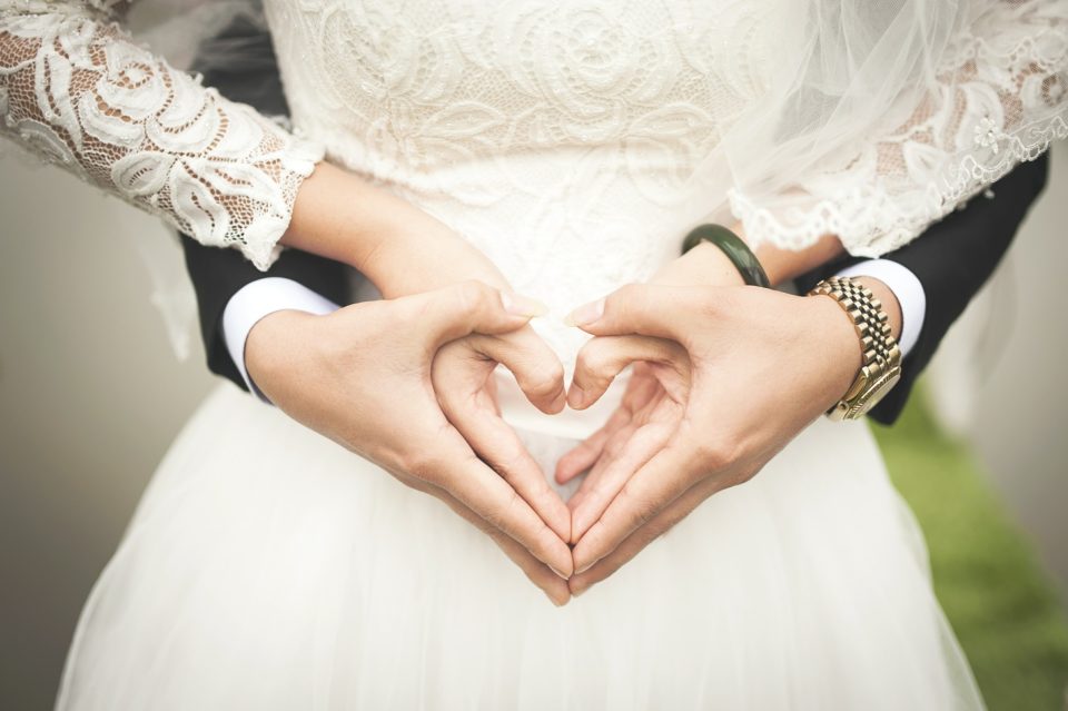 Wedding couple heart hands gesture