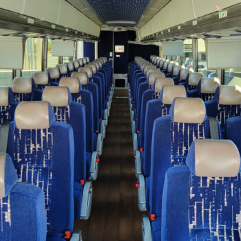 Spacious blue charter bus interior