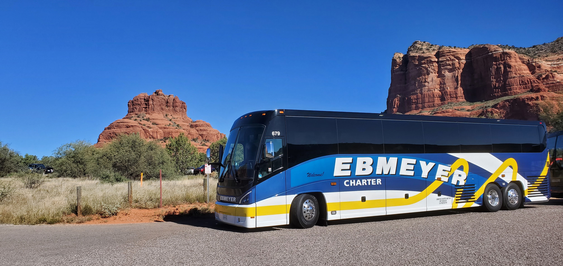 Charter bus in scenic landscape