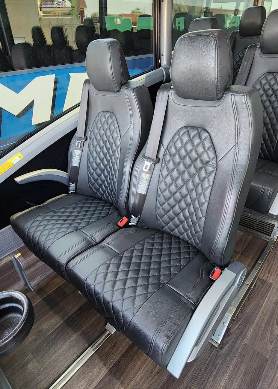 Luxurious black charter bus seating