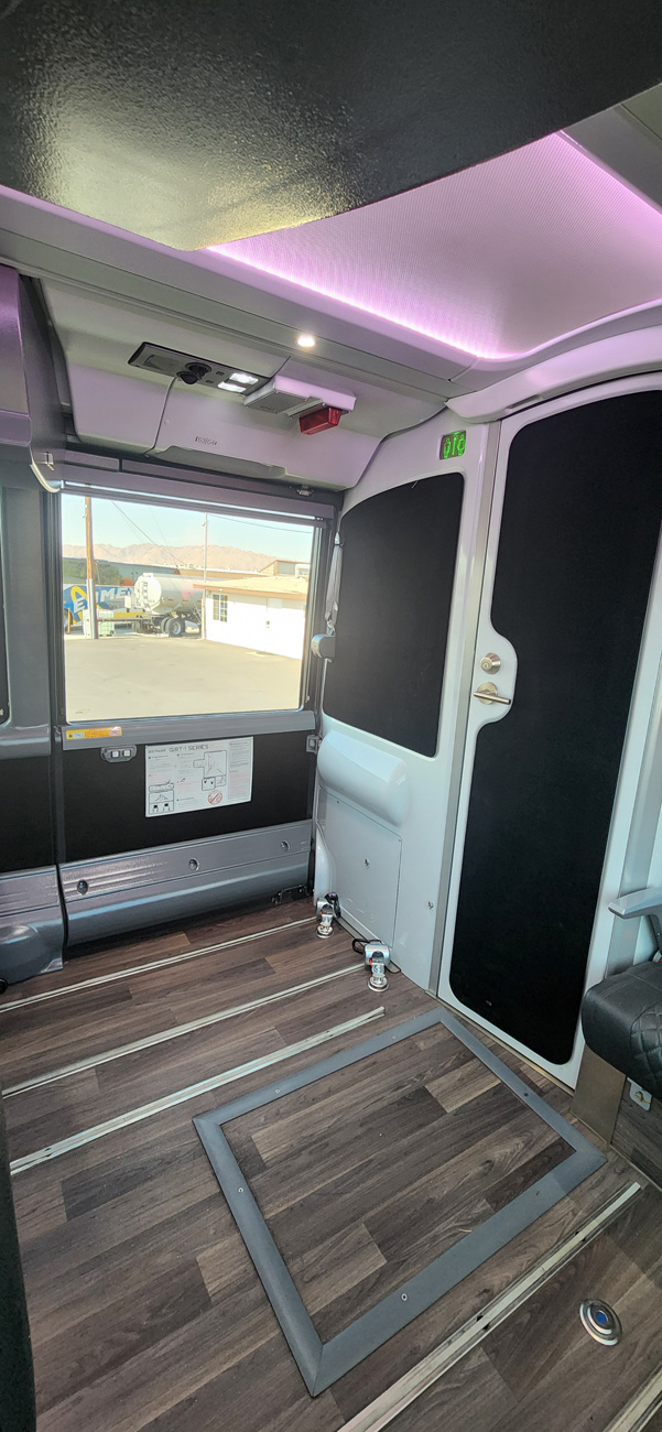 Spacious charter bus interior features