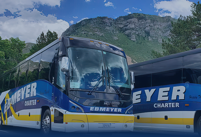 Charter buses in scenic mountains