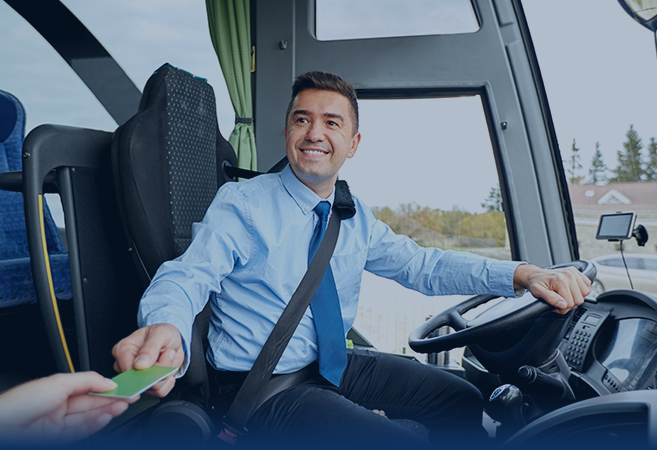 Friendly bus driver receiving ticket